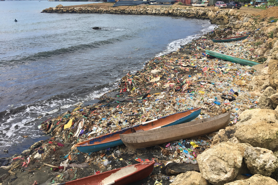 a beach covered in rubbish