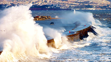 waves over a rock