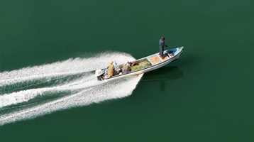 two people on a boat in sea