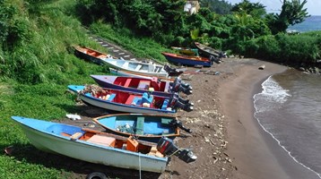 fishing boats on a beach in Dominica