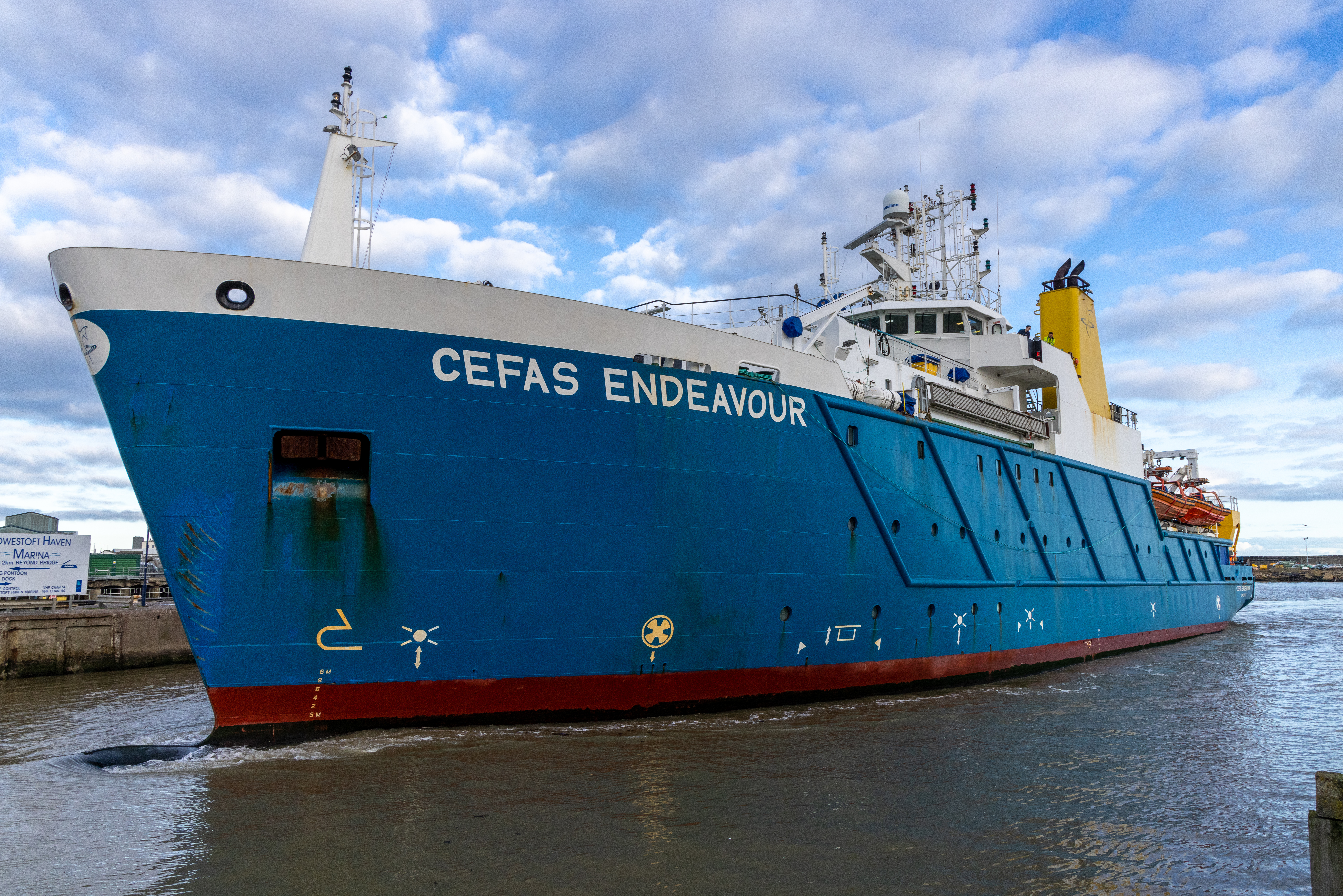 A blue ship in the docks