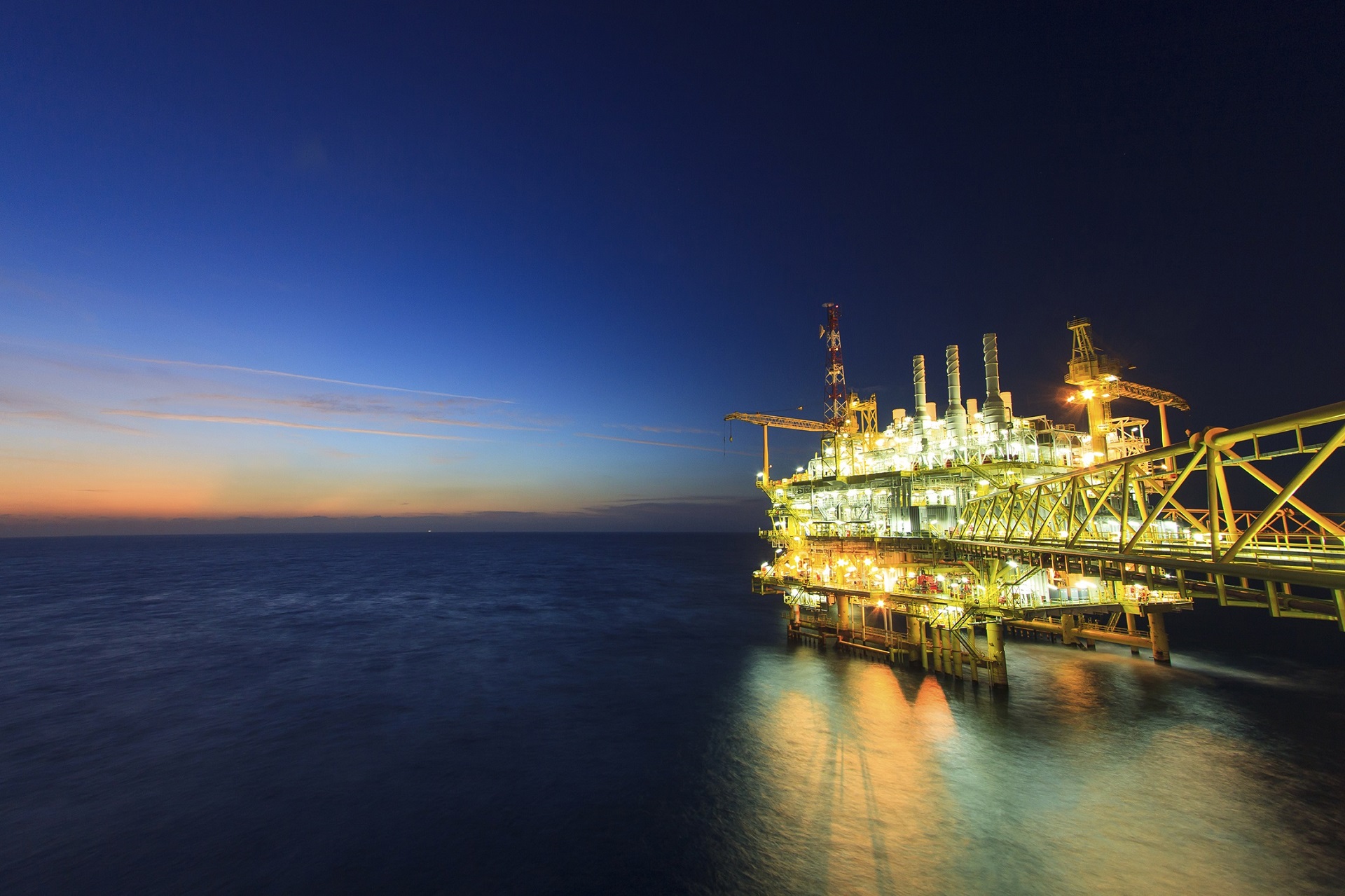 an offshore oil rig at night