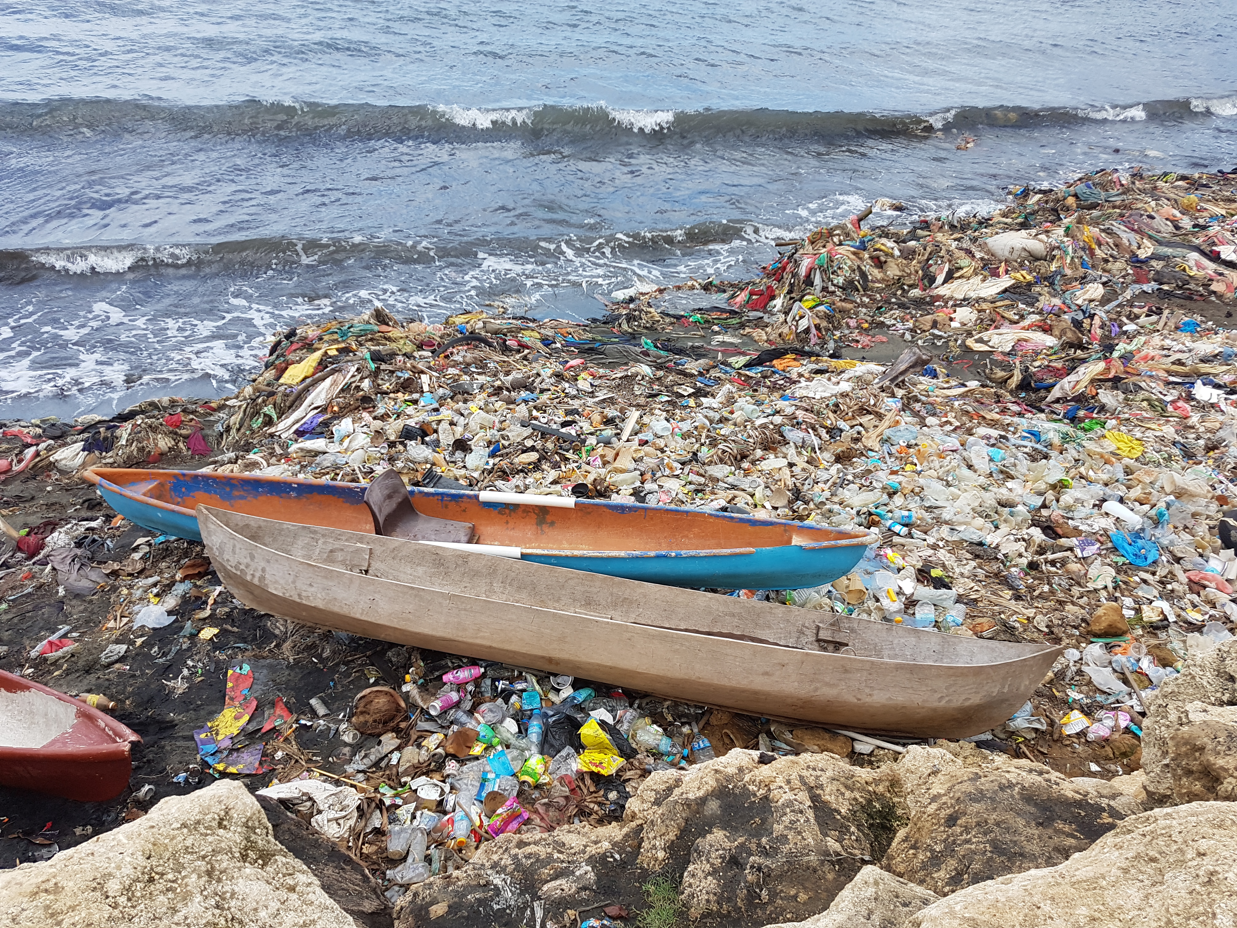 2 boats on litter on a beach